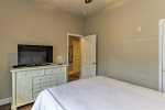 Guest bedroom with comfortable queen bed and flat screen TV